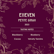 Wine label for E11EVEN Petite Sirah 2023 with tasting notes on a purple background with vine designs.