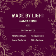 Wine label for 'Made by Light Sagrantino 2022' with tasting notes on a purple background with vine designs.