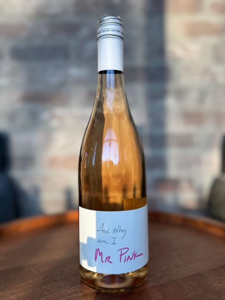 Wine bottle with a label on a wooden surface