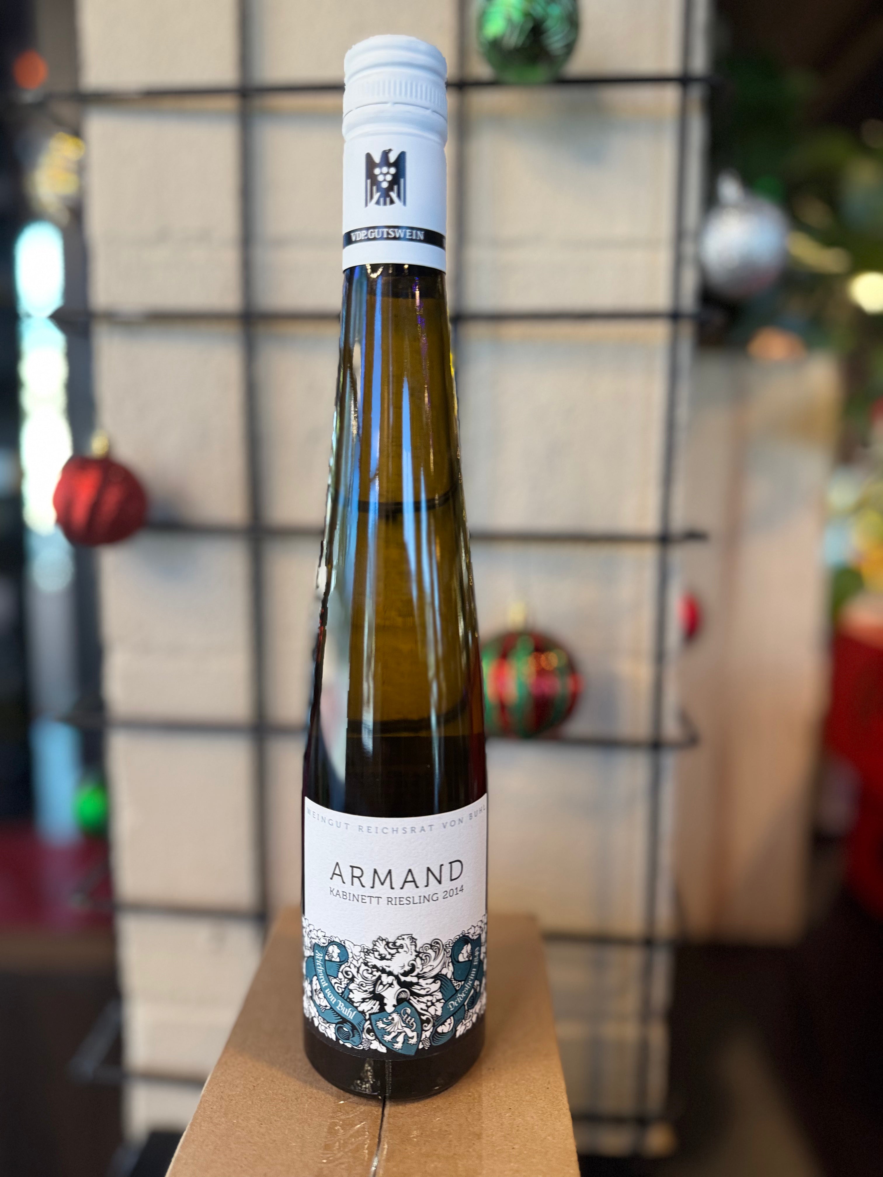 Bottle of Armand wine on a wooden surface with a blurred background