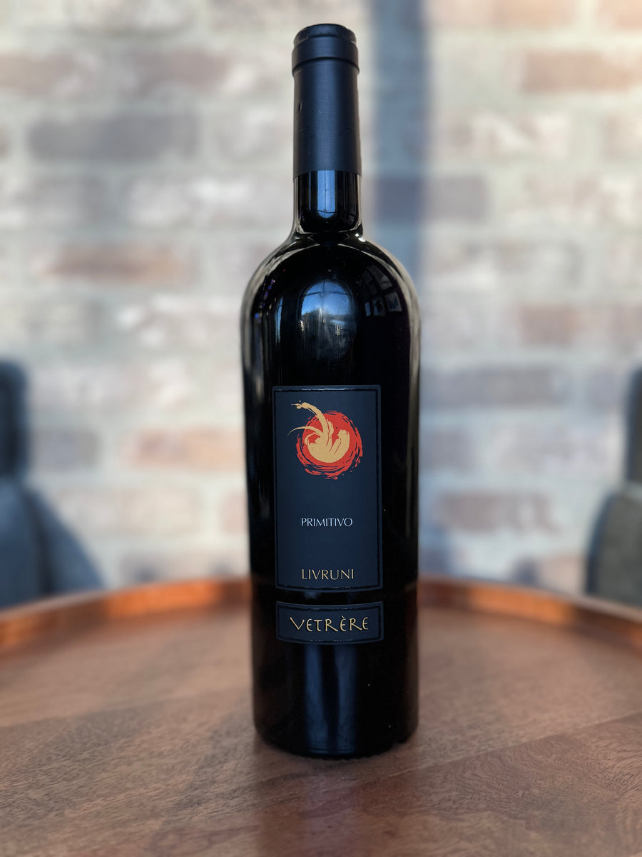 Wine bottle with a label on a wooden surface