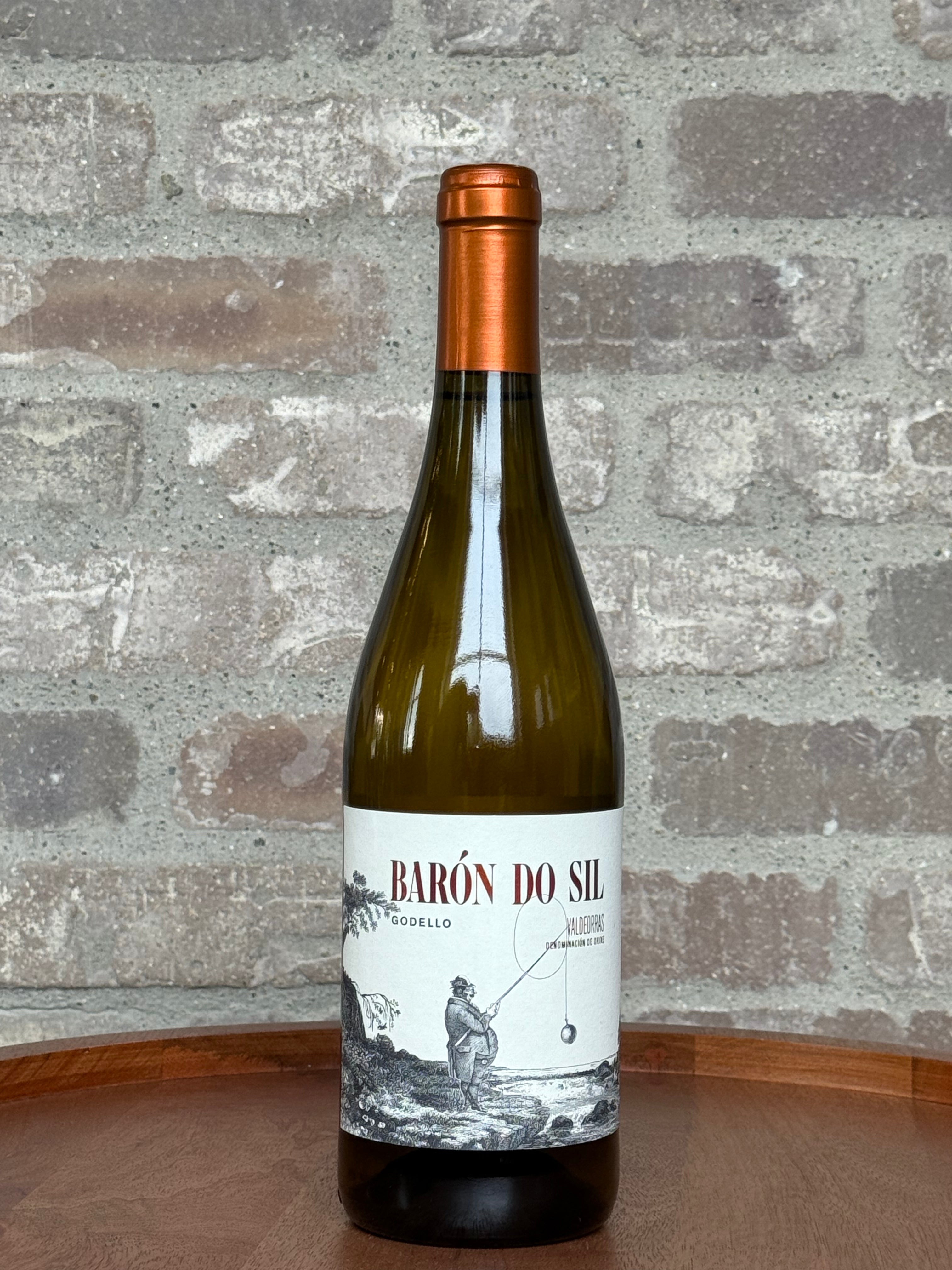 Wine bottle with a label featuring a fishing scene against a brick wall background