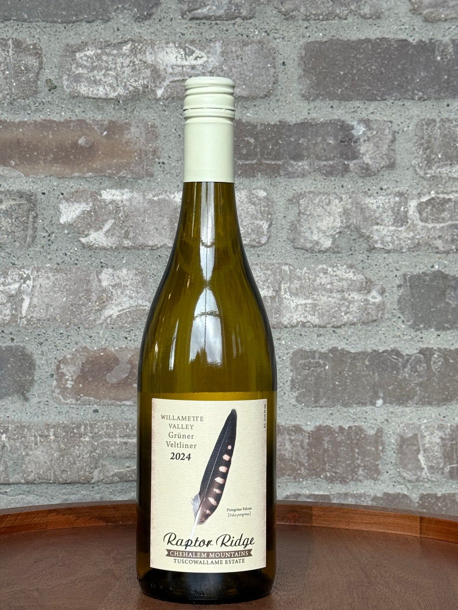 Wine bottle with label against a textured stone wall background