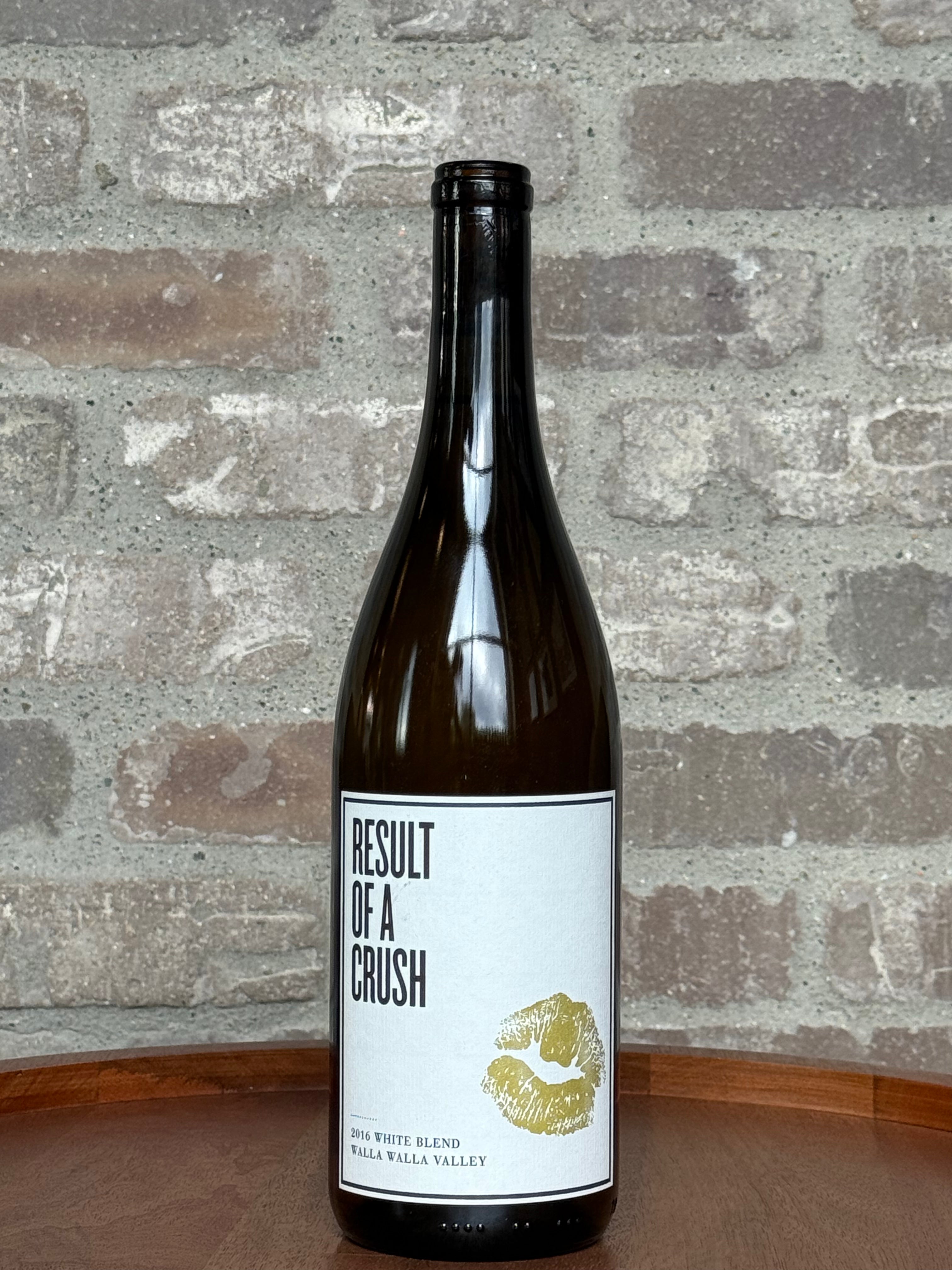 Wine bottle with a label titled 'Result of a Crush' against a brick wall background